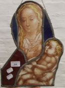 A stained glass panel depicting the Madonna and child. 34.5 cm high.