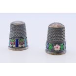 Two silver and enamel thimbles bearing Russian marks. 2.25 cm high.