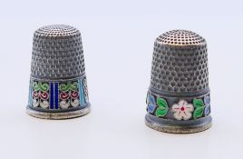 Two silver and enamel thimbles bearing Russian marks. 2.25 cm high.