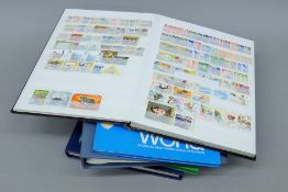 A quantity of stamp albums and loose stamps.
