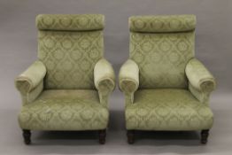 A pair of late 19th/early 20th century green upholstered armchairs. 80 cm wide.