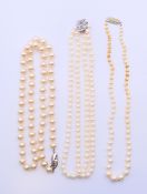 Three pearl necklaces. The largest 62 cm long.