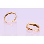 Two 18 ct gold wedding bands. 6.3 grammes.