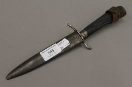 A German dagger in scabbard, the blade inscribed ED WUSTHOF SOLINGEN. 28 cm long.