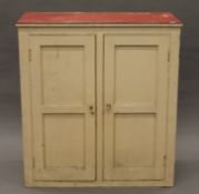 A Victorian white painted pine cupboard. 93 cm wide, 102 cm high, 46 cm deep.