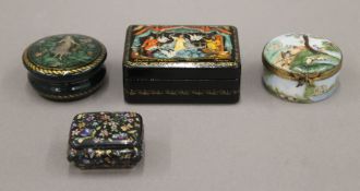 Two small Limoges boxes and two lacquered boxes. The largest 7.5 cm wide.