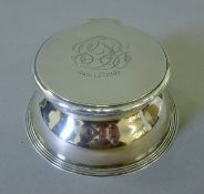 A silver-clad glass inkwell. 11 cm diameter.
