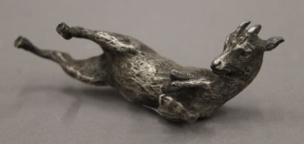 A silver plate-mounted model of a goat. 12 cm long.