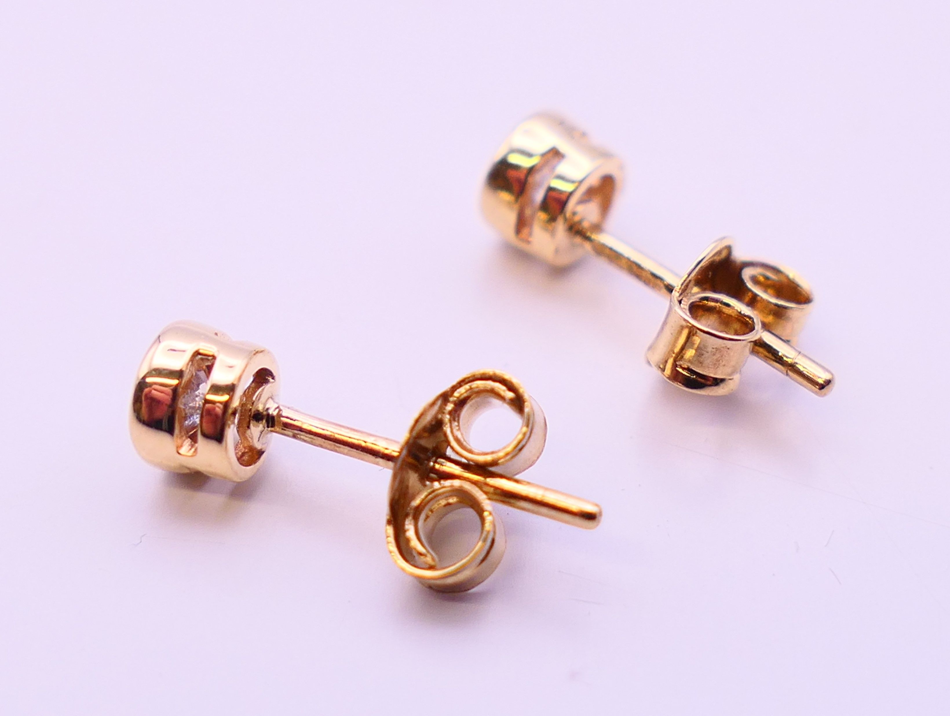 A pair of 9 ct gold diamond earrings. 0.5 ct weight. - Image 5 of 5