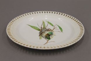 A 19th century Minton plate decorated with a hummingbird in her nest. 23 cm diameter.