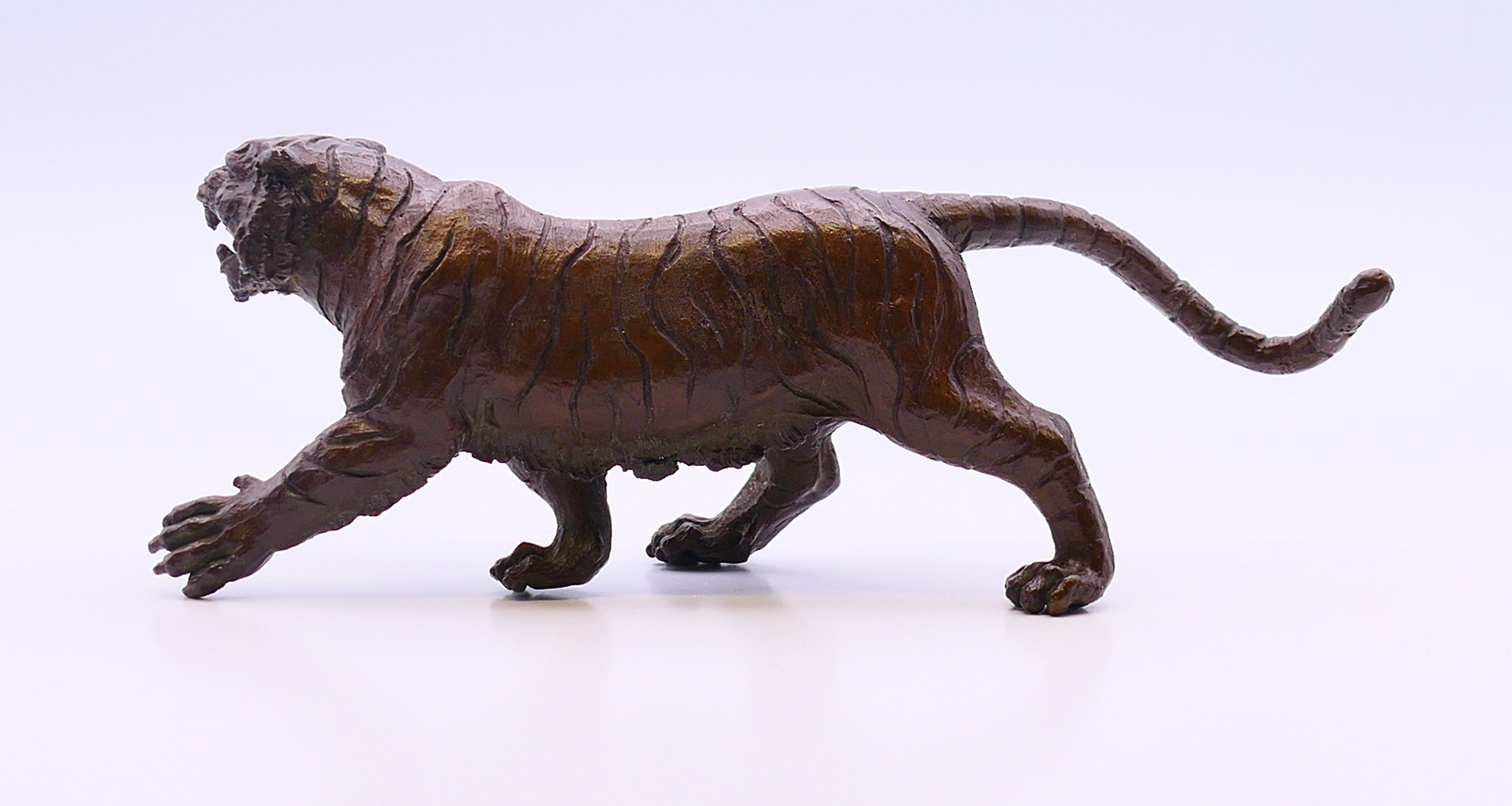 A bronze model of a tiger. 12 cm long, 5 cm high. - Image 4 of 4