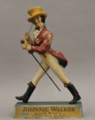 A Johnnie Walker advertising figure. 37 cm high.