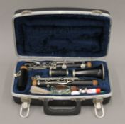 A cased clarinet. The case 33 cm wide.