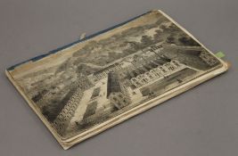 A 19th century scrap book including various cuttings and prints. 20 cm wide.