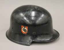 A WWII period Nazi SS police helmet.