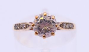 A 9 ct gold diamond solitaire ring. Ring size N.