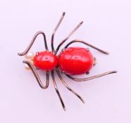 A silver gilt bug/spider brooch. 3.5 cm x 3.5 cm.