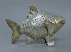 A white metal reticulated model of a fish stamped T90. 24.5 cm long. 16.7 troy ounces.