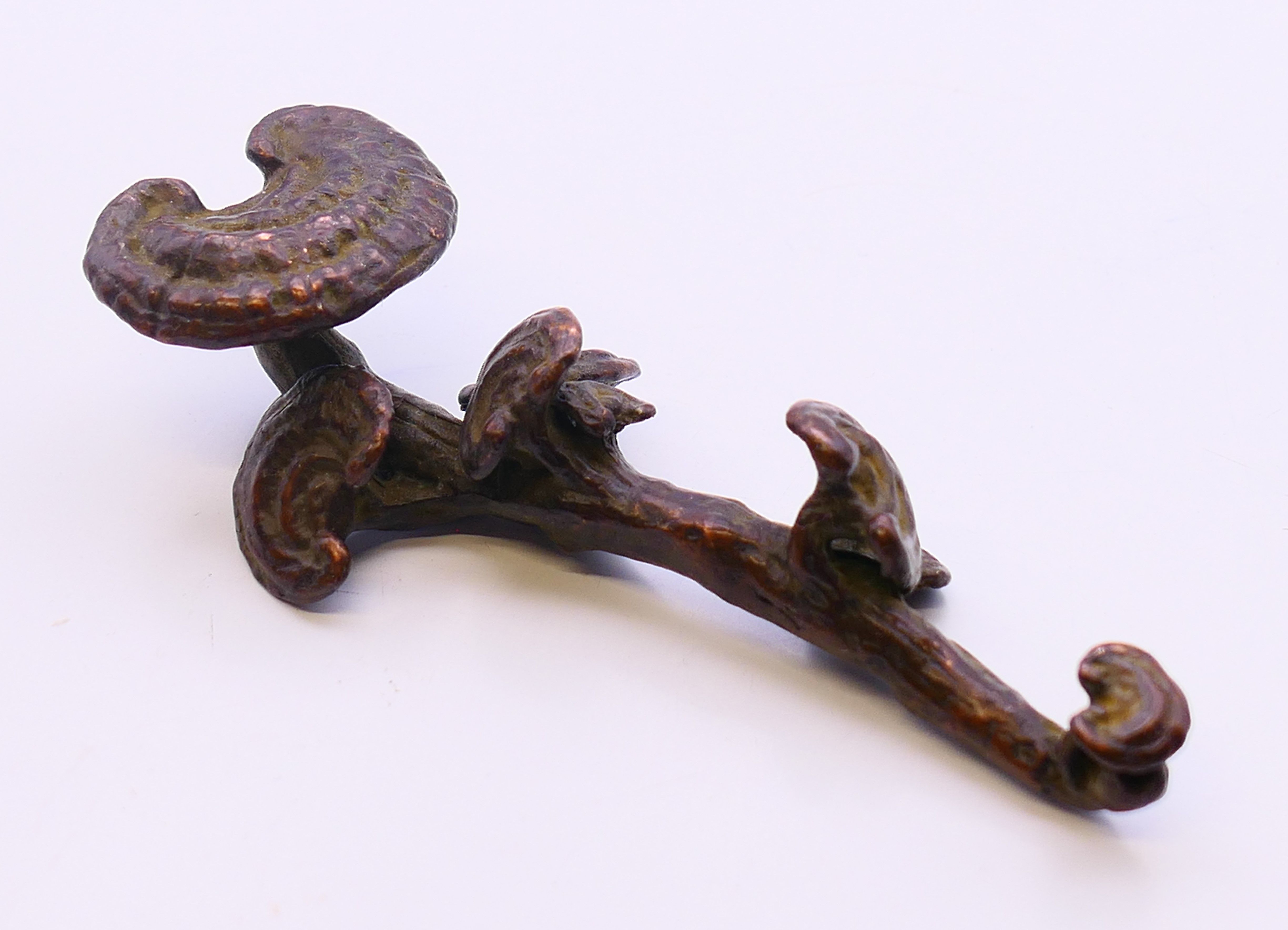 A small bronze ruyi sceptre. 9.5 cm long.