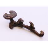 A small bronze ruyi sceptre. 9.5 cm long.