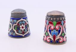 Two silver and enamel thimbles bearing Russian marks. Approximately 2.25 cm high.