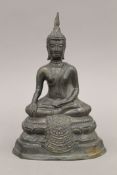 A 19th century bronze model of Buddha. 23 cm high.