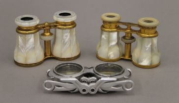 Three pairs of opera glasses, including an unusual folding pair.
