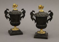 A pair of 19th century ormolu and patinated bronze lidded urns. 15 cm high.