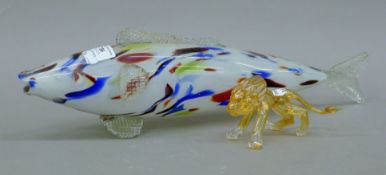A Murano or Romanian glass fish and a lion. The former 46 cm long.