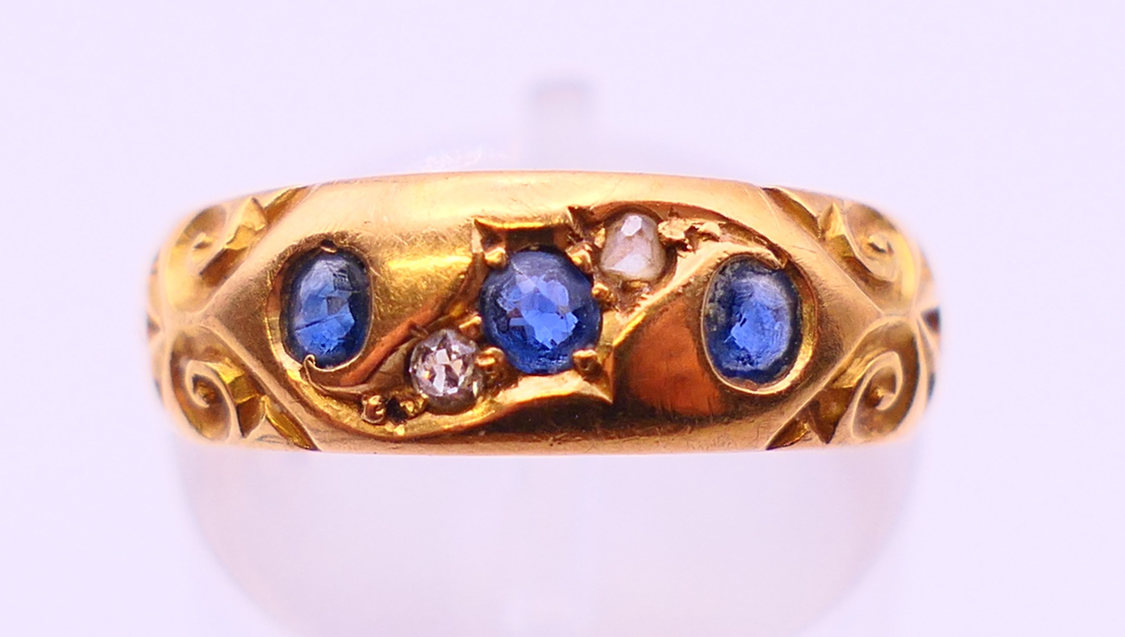 An 18 ct gold diamond and sapphire ring. 4 grammes. Ring size L/M. - Image 2 of 5