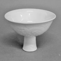 A white Chinese porcelain stem cup. 11 cm high.