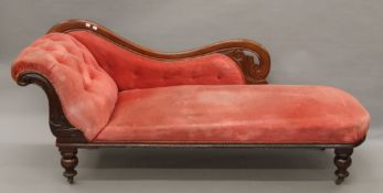 A Victorian upholstered mahogany chaise lounge. 190 cm long.