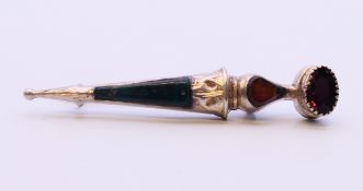A silver Scottish dirk form brooch set with amethyst and agate. 6 cm high.