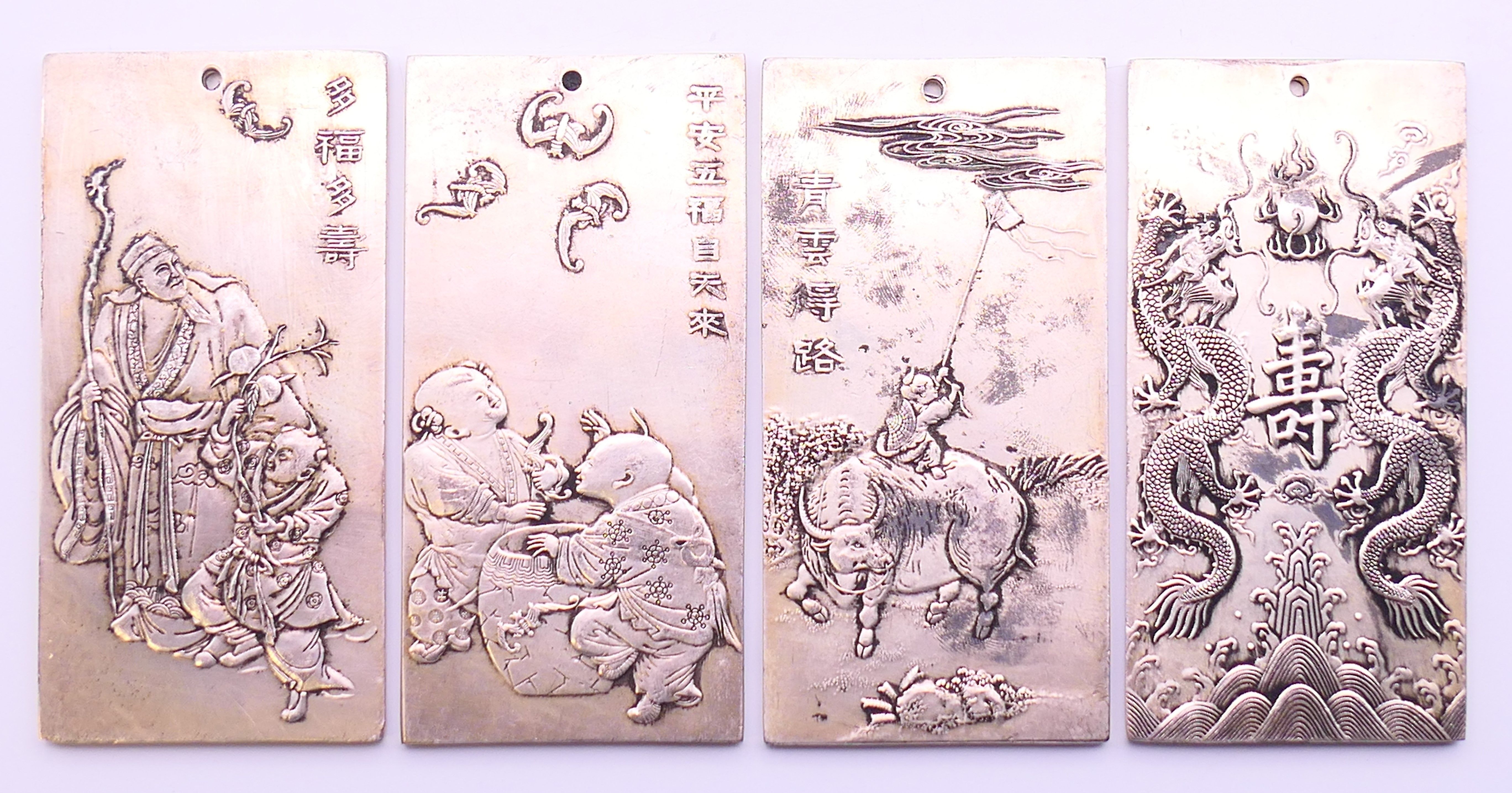 Four Chinese bars. Each 10 cm x 5 cm.