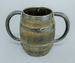 A sterling silver mounted wooden barrel-form twin-handled tankard. 1.5 cm high.