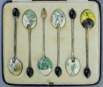 A cased set of silver enamel coffee spoons, in a Goldsmiths & Silversmiths Company Ltd box. Each 9.