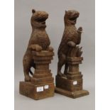 Two Eastern carved wooden mythical beasts. Each approximately 43 cm high.