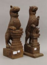 Two Eastern carved wooden mythical beasts. Each approximately 43 cm high.