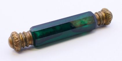 A Victorian green glass double-ended scent bottle. 11.5 cm long.