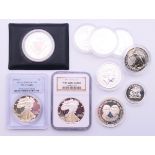 Ten various silver proof coins including two fine silver one dollars.