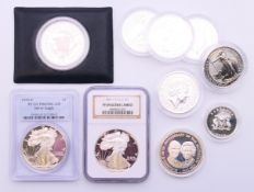 Ten various silver proof coins including two fine silver one dollars.