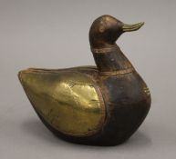 An Eastern brass mounted wooden duck. 17 cm long.