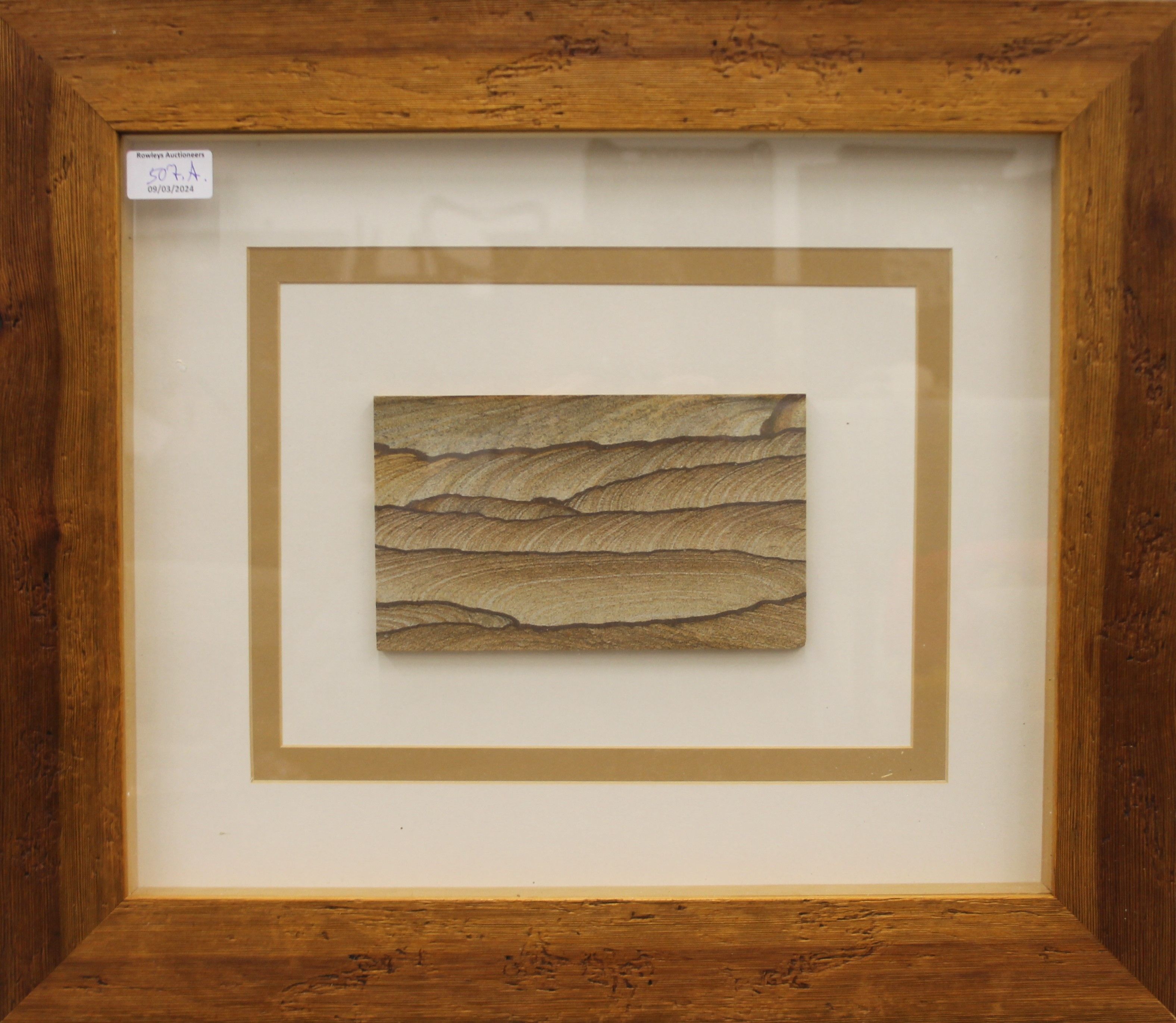 A Kanab Goldstone sample, housed in a boxed frame and glazed. 53.5 x 46 cm. - Image 2 of 2