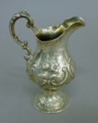 A large Victorian silver cream jug. 15 cm high. 5.3 troy ounces.