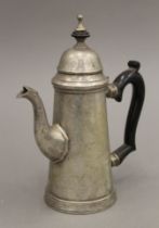 A silver-plated coffee pot. 22 cm high.