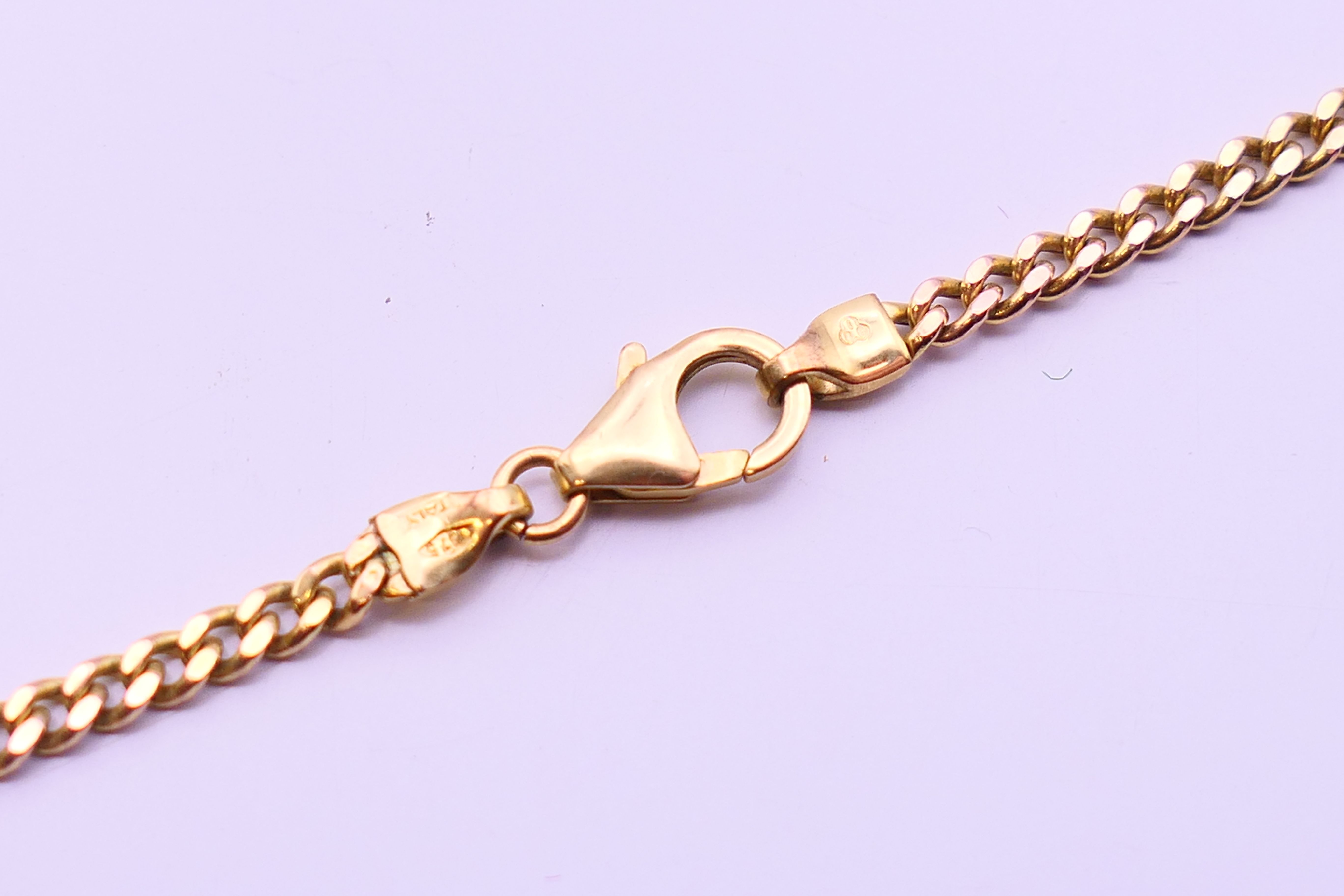 A Rotary fob watch on a 9 ct gold chain. 2.5 cm diameter, chain 62 cm long. The chain 6 grammes. - Image 6 of 8