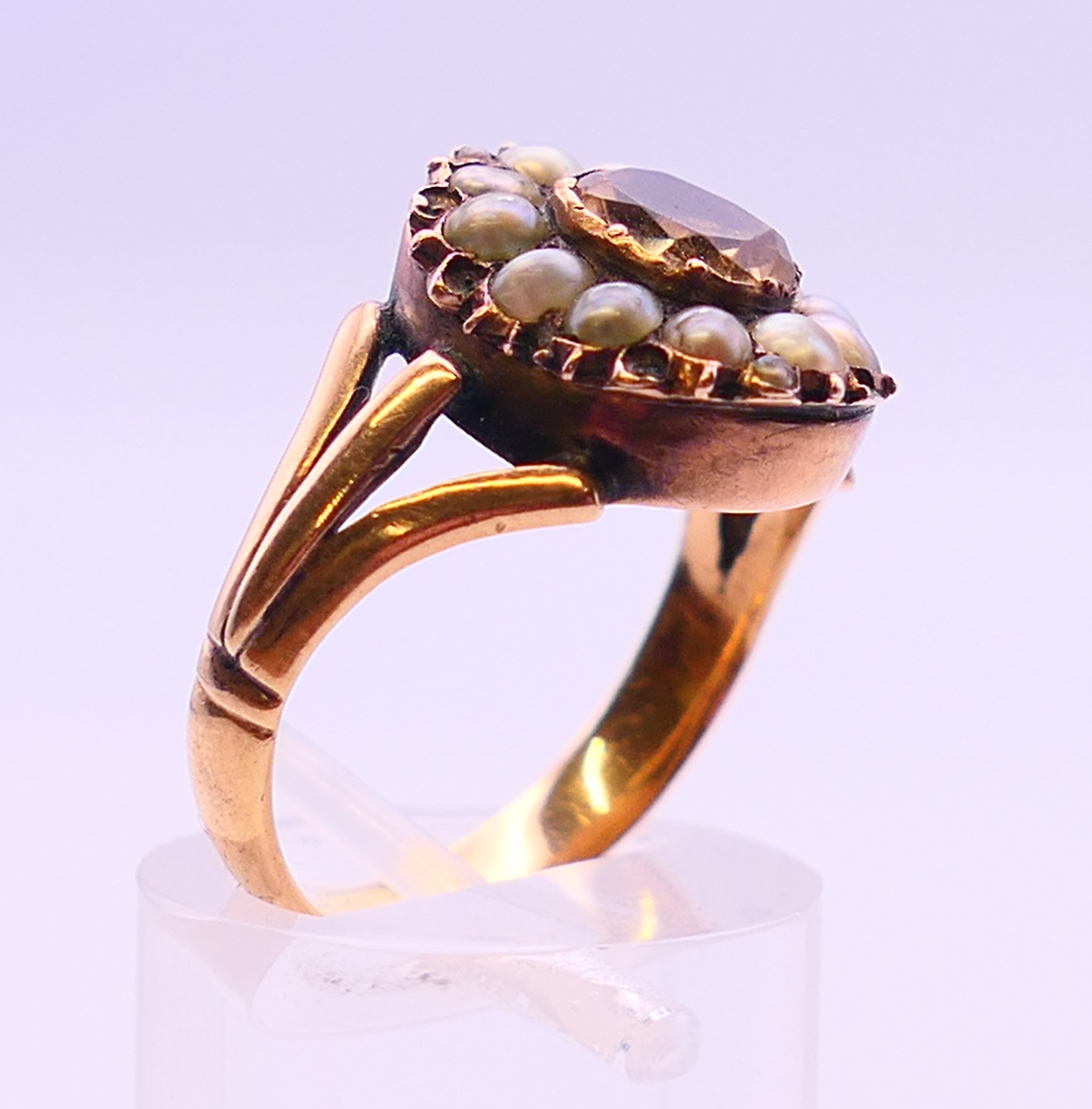 A Georgian unmarked gold Imperial topaz and seed pearl ring. Ring size N. - Image 3 of 5