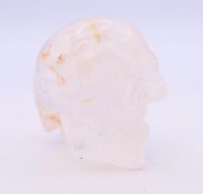 A rock crystal skull. 6 cm high.