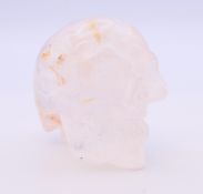 A rock crystal skull. 6 cm high.