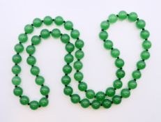 A string of jade beads. Approximately 66 cm long.